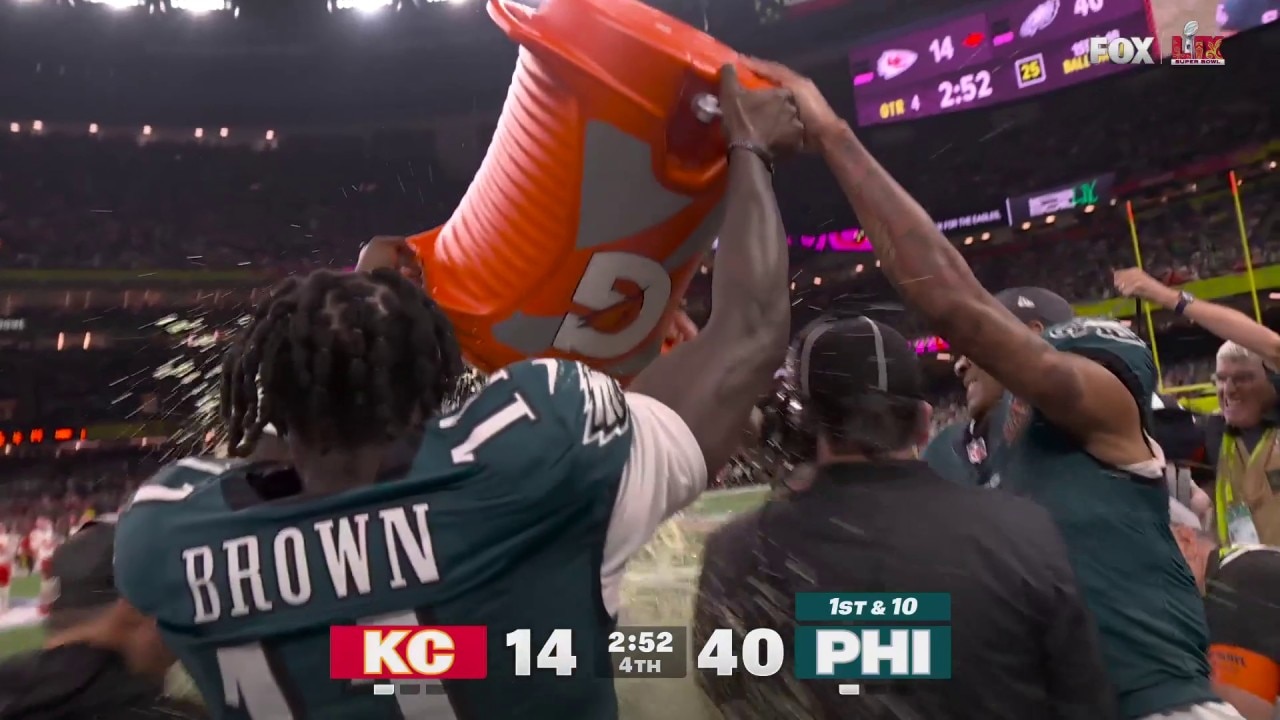 A.J. Brown and DeVonta Smith shower Nick Sirianni with Gatorade during Super Bowl LIX