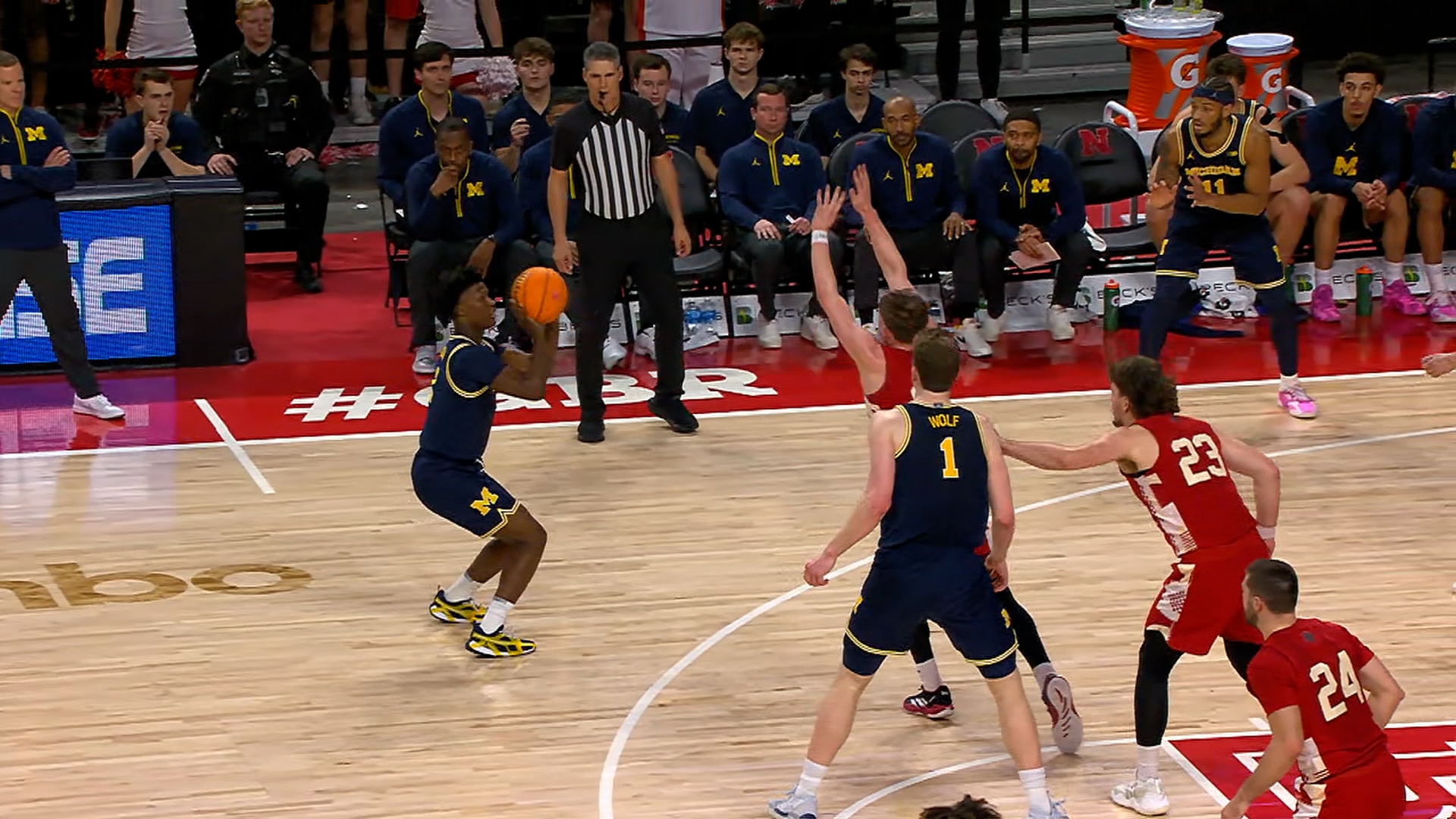 L.J. Cason drains a clutch 3-pointer to help seal No. 15 Michigan's victory over Nebraska