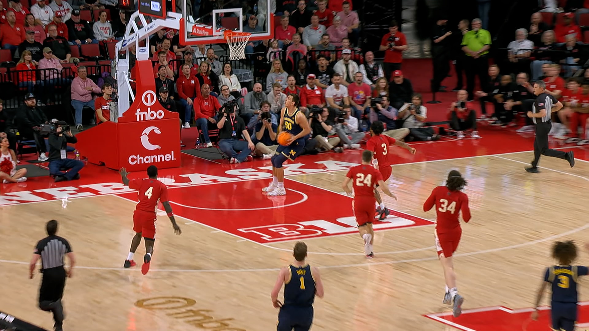 Michigan's Vladislav Goldin runs the fast break for an easy jam vs. Nebraska