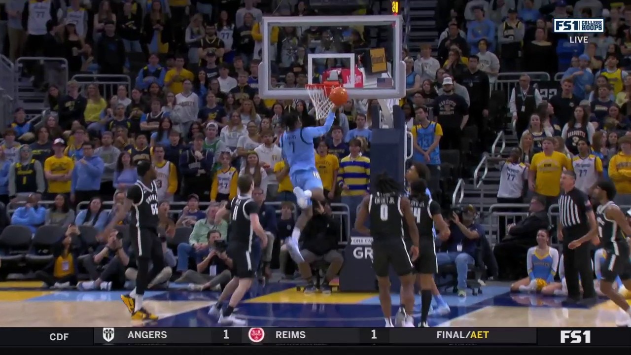 Zaide Lowery makes an acrobatic layup, extending Marquette's lead over Providence