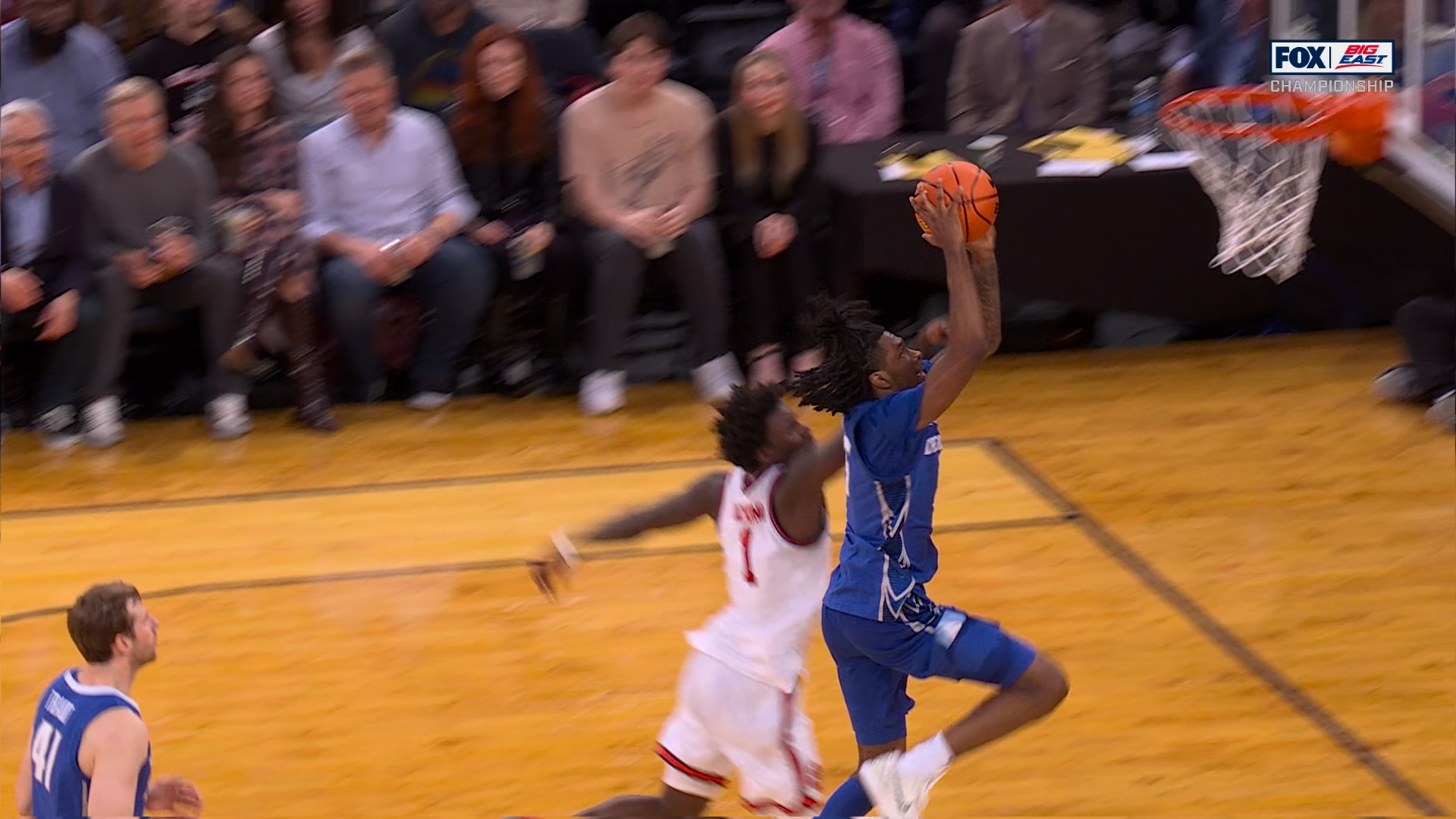 Creighton's Jamiya Neal throws down a two-handed dunk to cut St. John's lead